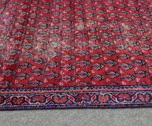Vintage Persian runner rug border detail blue and red design