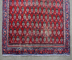 Hand knotted wool Shiraz runner rug fringe and edge detail