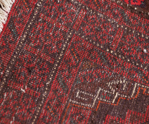 Backside of hand knotted vintage Baluchi Persian rug showing dense weave and authentic wool foundation
