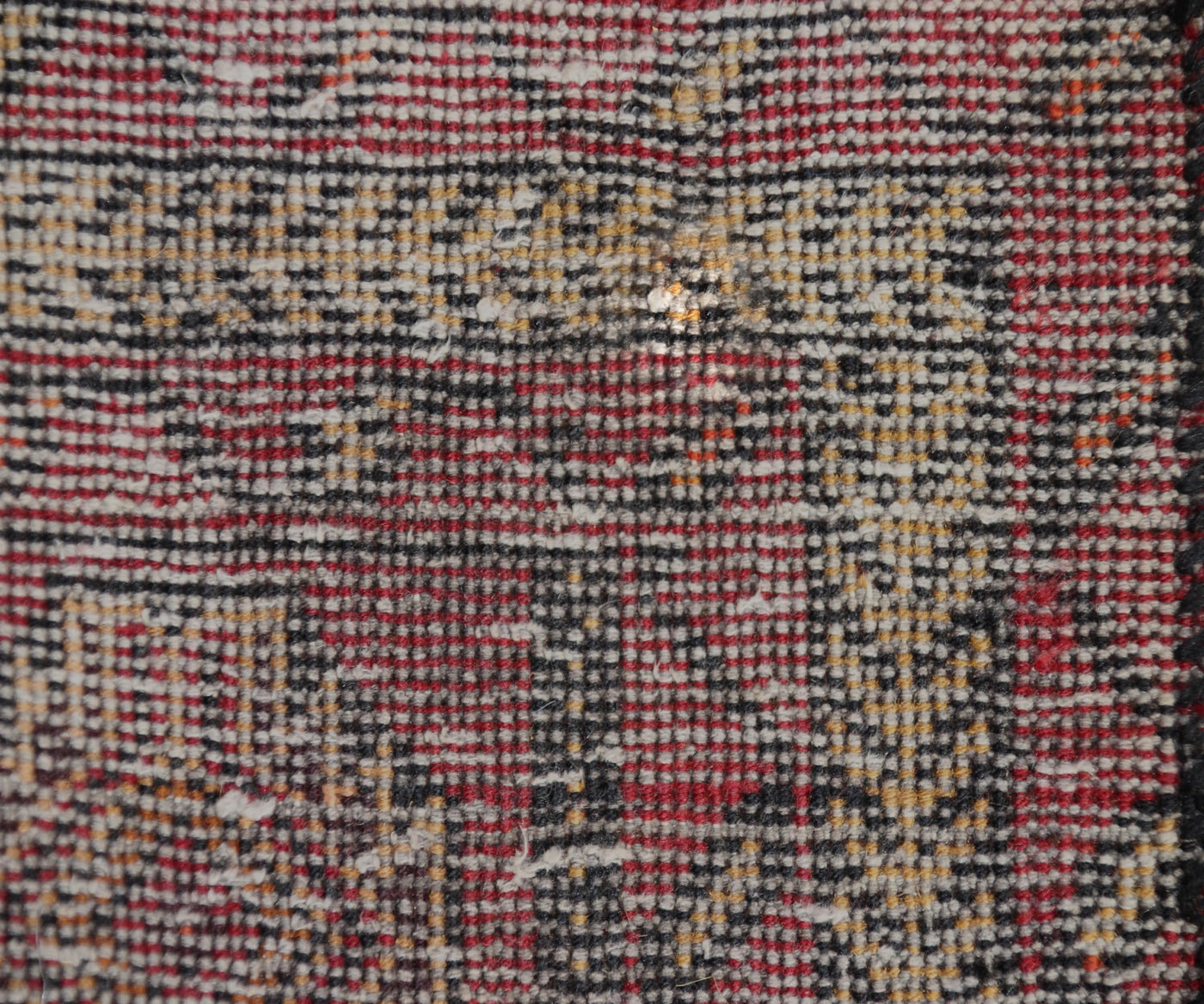 Backside of vintage Turkmen Persian runner rug showing dense hand knotted weave and wool foundation
