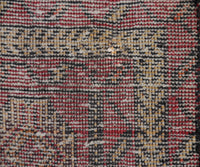 Backside of vintage Turkmen Persian runner rug showing dense hand knotted weave and wool foundation
