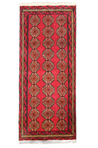 Hand knotted vintage Turkmen Persian runner rug with rich red tribal gul pattern
