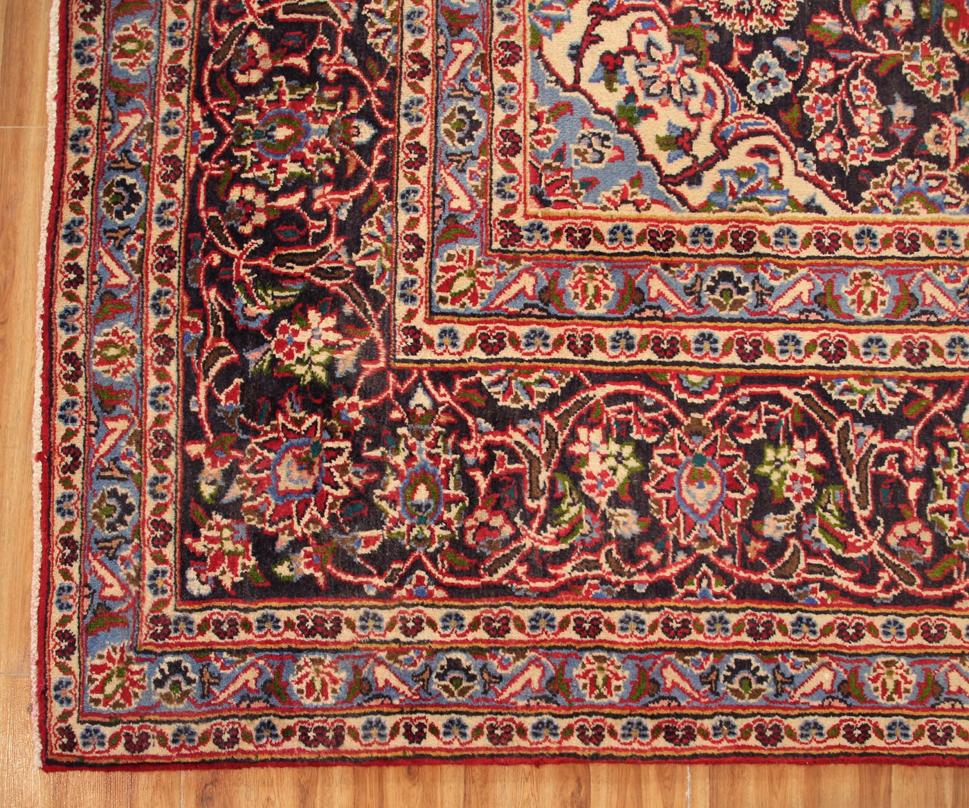 Ornate border detail of vintage Mashad Persian rug with layered floral guard stripes
