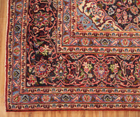 Ornate border detail of vintage Mashad Persian rug with layered floral guard stripes
