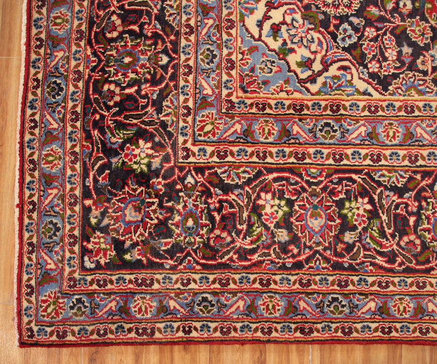 Ornate border detail of vintage Mashad Persian rug with layered floral guard stripes
