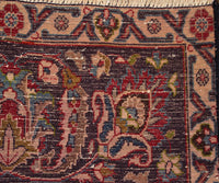 Backside of hand knotted vintage Mashad Persian rug showing fine weave density and traditional wool foundation
