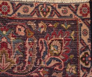 Backside of hand knotted vintage Mashad Persian rug showing fine weave density and traditional wool foundation
