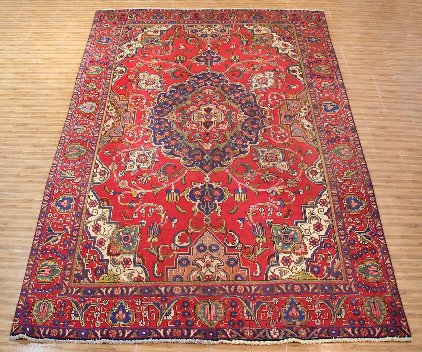 Large vintage Tabriz Persian rug 285x385 cm full view showing intricate floral design and detailed corner spandrels
