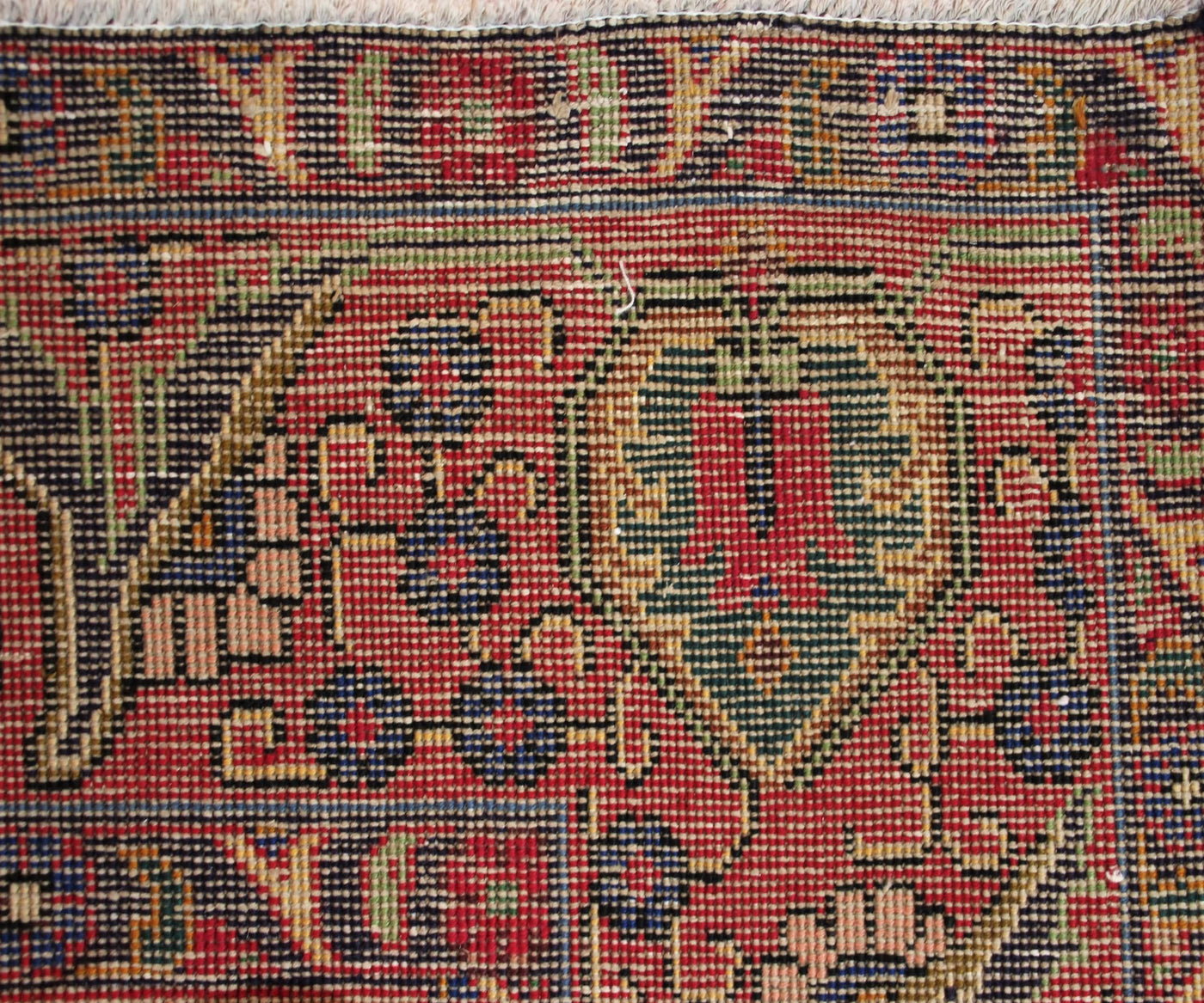 Backside of vintage Tabriz Persian rug showing fine weave density and traditional hand knotted construction
