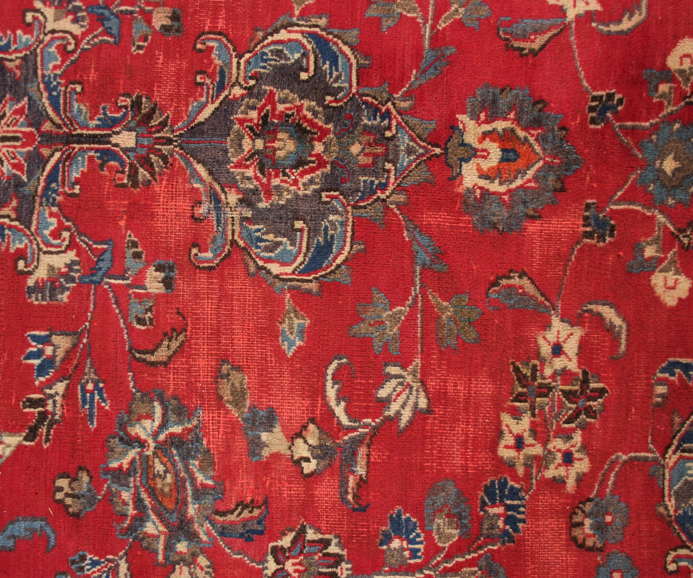 Close-up of Mashad Persian rug central medallion with detailed floral arabesque design
