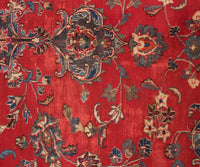 Close-up of Mashad Persian rug central medallion with detailed floral arabesque design
