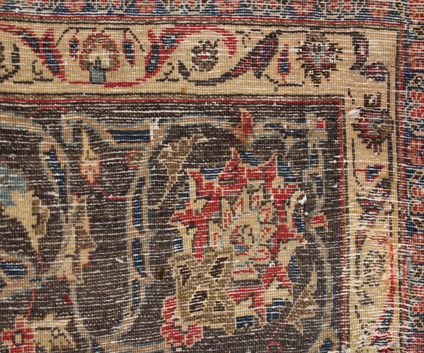 Backside of vintage Mashad Persian rug showing fine weave density and traditional hand knotted construction
