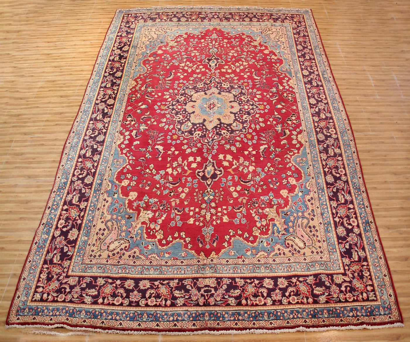 Antique Sabzevar Persian rug 295x393 cm full view showing intricate floral design and wide decorative borders

