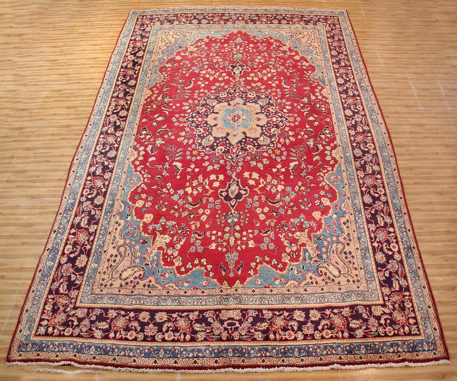 Antique Sabzevar Persian rug 295x393 cm full view showing intricate floral design and wide decorative borders
