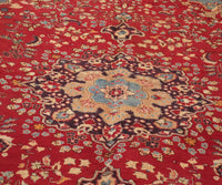 Close-up of Sabzevar Persian rug central medallion with detailed floral arabesque pattern
