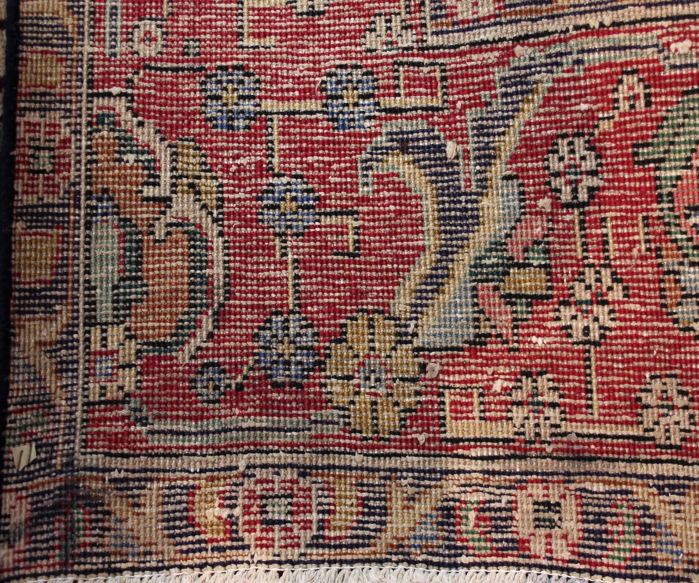 Backside of hand knotted antique Tabriz Persian rug showing fine weave density and traditional wool foundation
