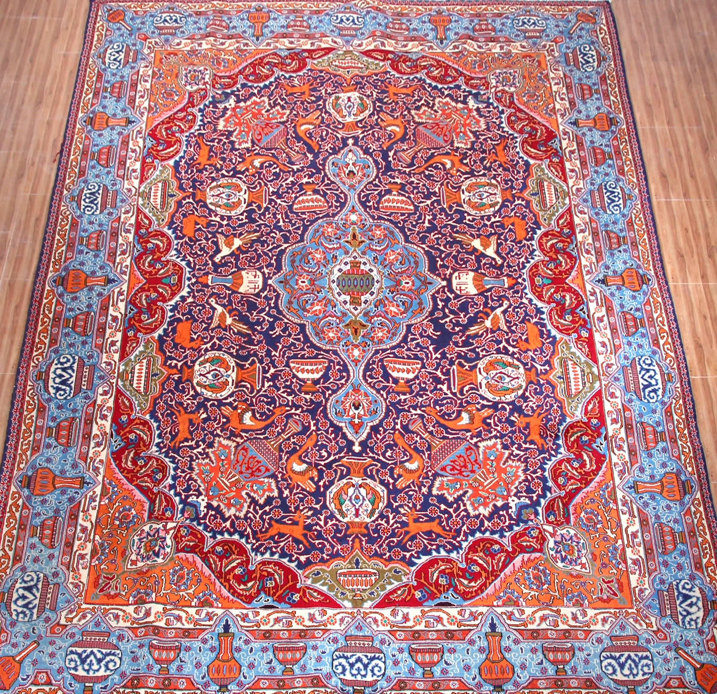 Large Kashmar Persian rug on wooden floor, hand knotted vintage wool
