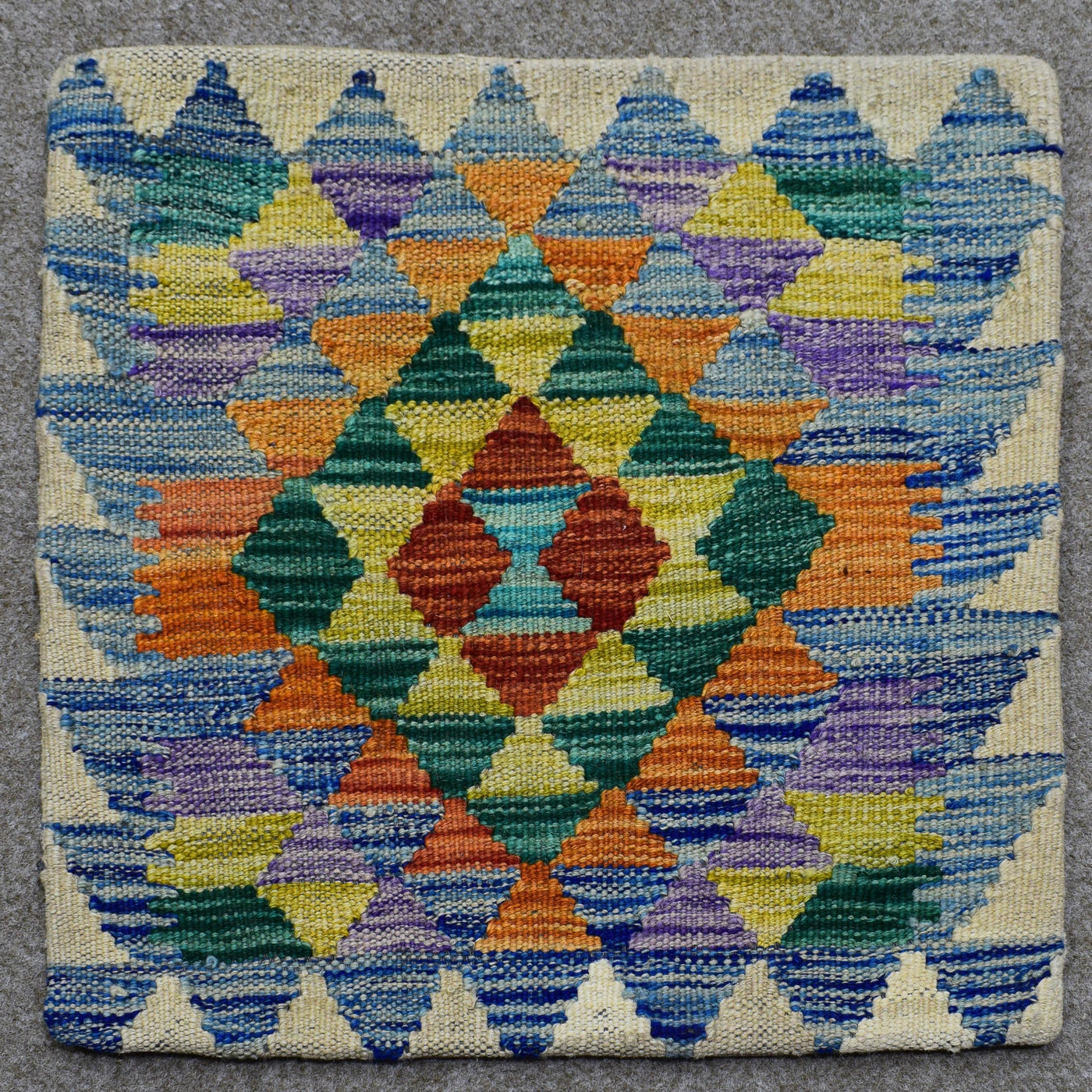 Hand woven cushion cover 45x45 cm with colorful geometric diamond pattern in orange, green, purple and blue