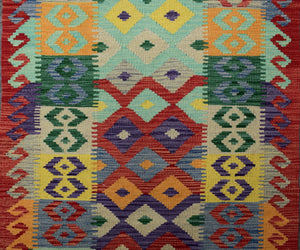 Close-up of Chobi kilim runner showing detailed flatweave texture and bold tribal diamond motifs

