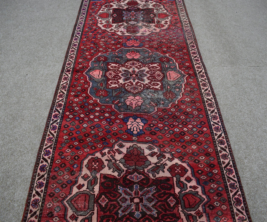 Hand knotted Shiraz runner rug with central medallion design