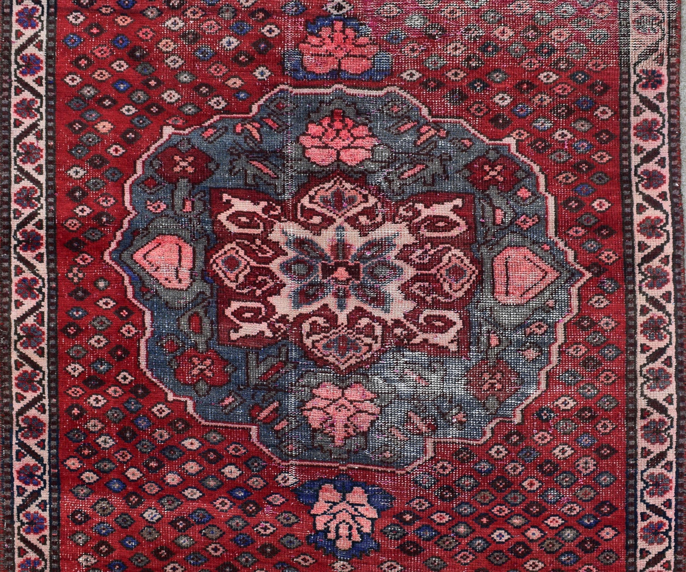 Persian Shiraz runner rug central medallion close-up red and blue