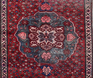 Persian Shiraz runner rug central medallion close-up red and blue