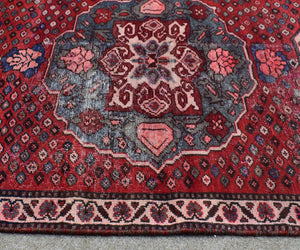 Vintage Persian runner rug detailed tribal pattern red tones