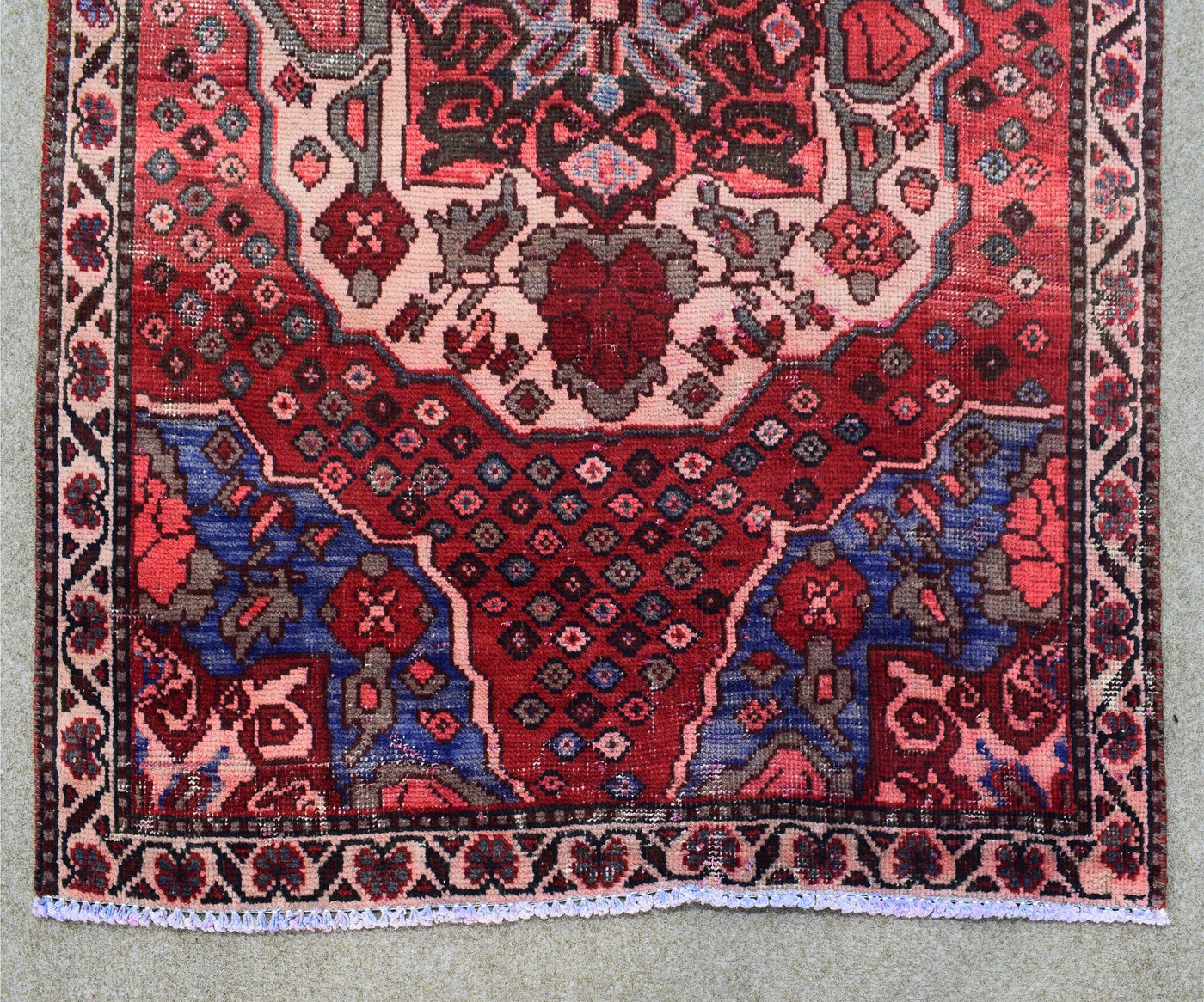 Hand knotted Shiraz runner rug border detail red and navy