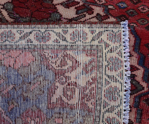Back of hand knotted Persian Shiraz runner rug showing wool weave