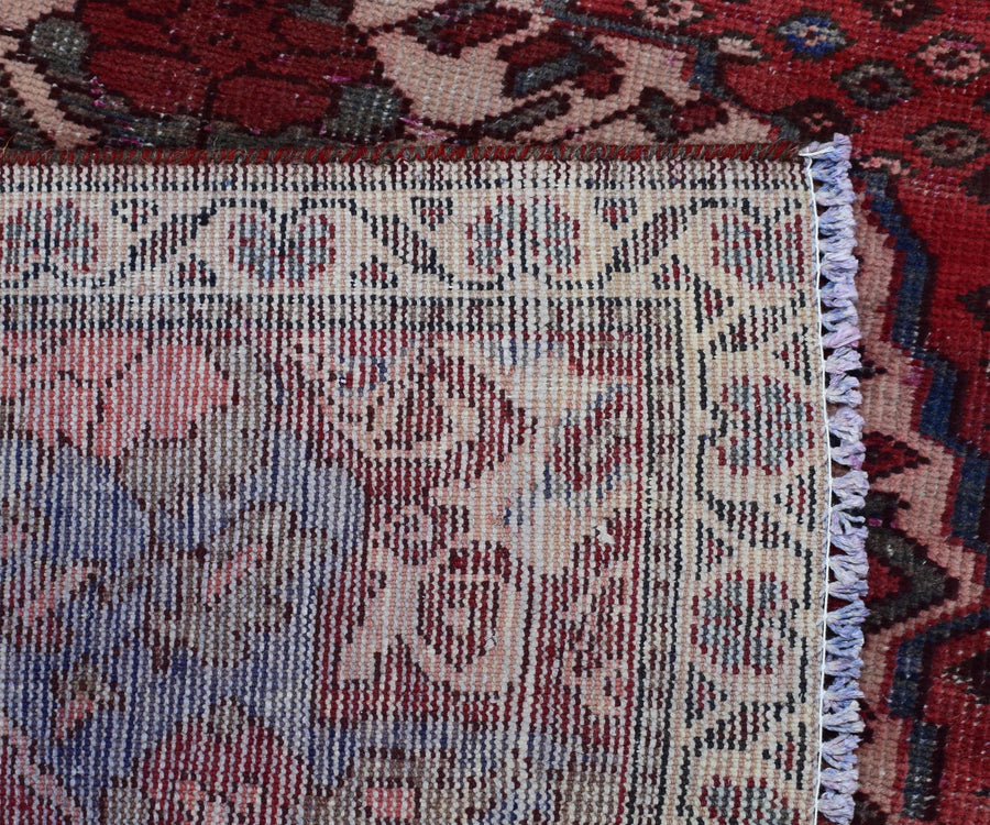 Back of hand knotted Persian Shiraz runner rug showing wool weave