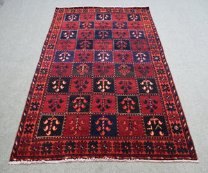 Vintage Persian Shiraz rug 145x233 cm with geometric tribal motifs in red tones