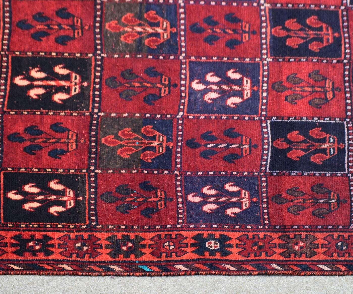 Traditional Shiraz Persian rug pattern with tribal motifs and deep red colors