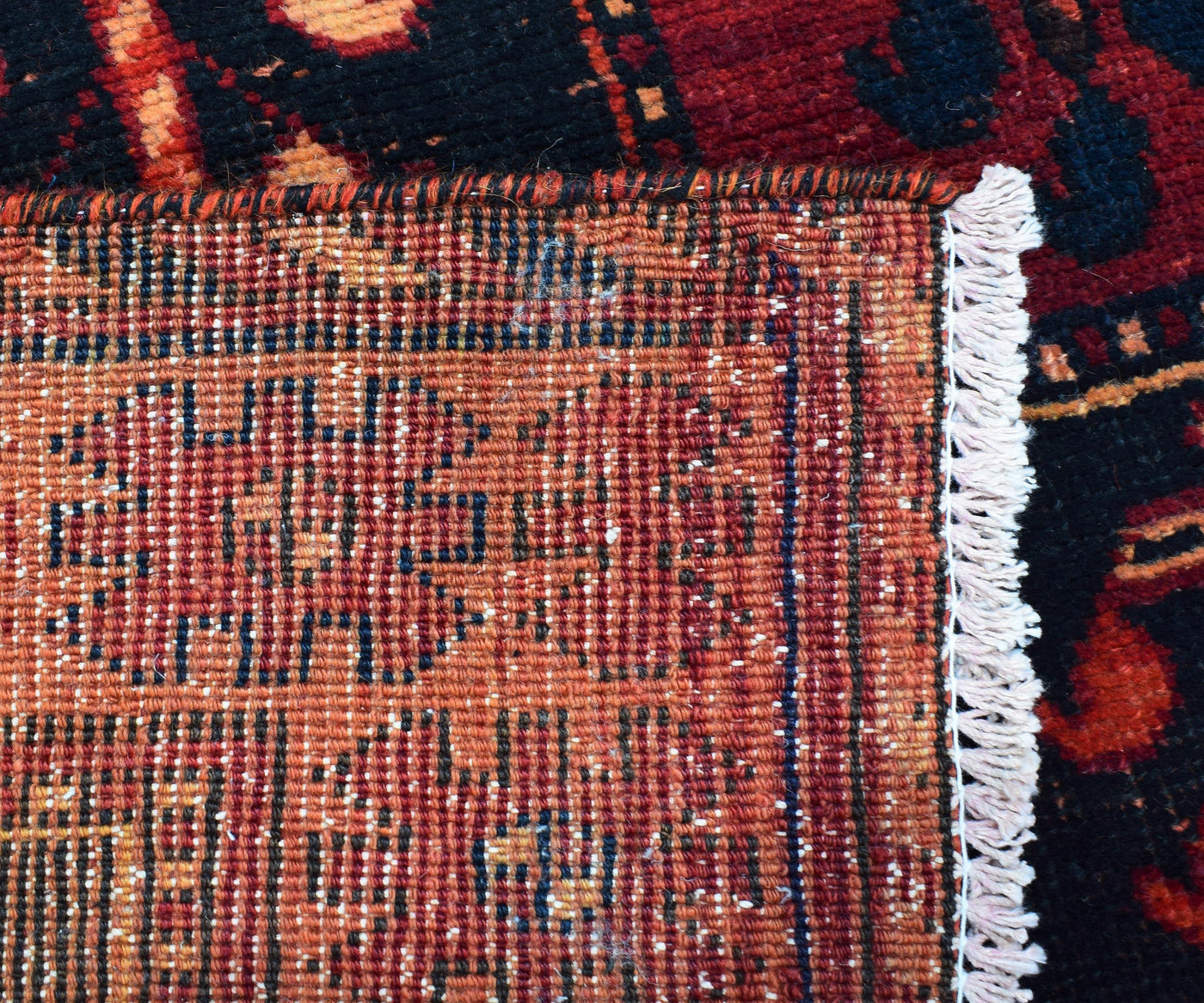 Backside of hand knotted Persian Shiraz rug showing authentic weaving craftsmanship