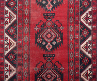 Close-up of antique Persian Shiraz rug showing intricate tribal geometric pattern