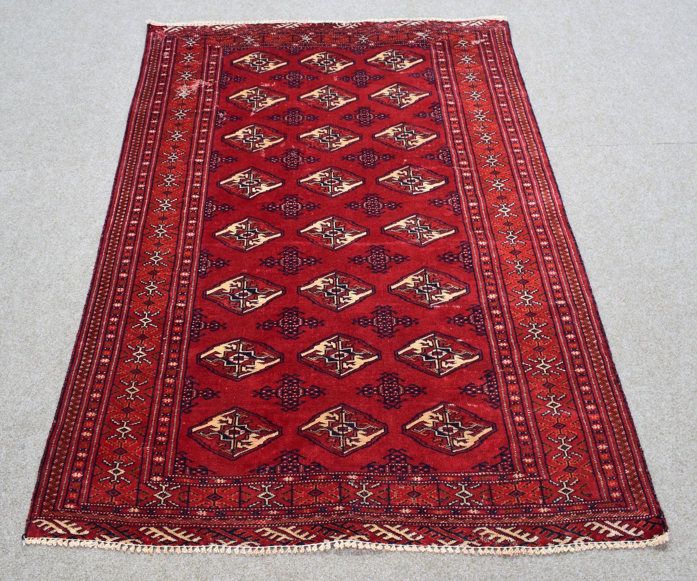 Vintage Persian Shiraz rug 120x168 cm full view showing repeating diamond tribal motifs on deep red field