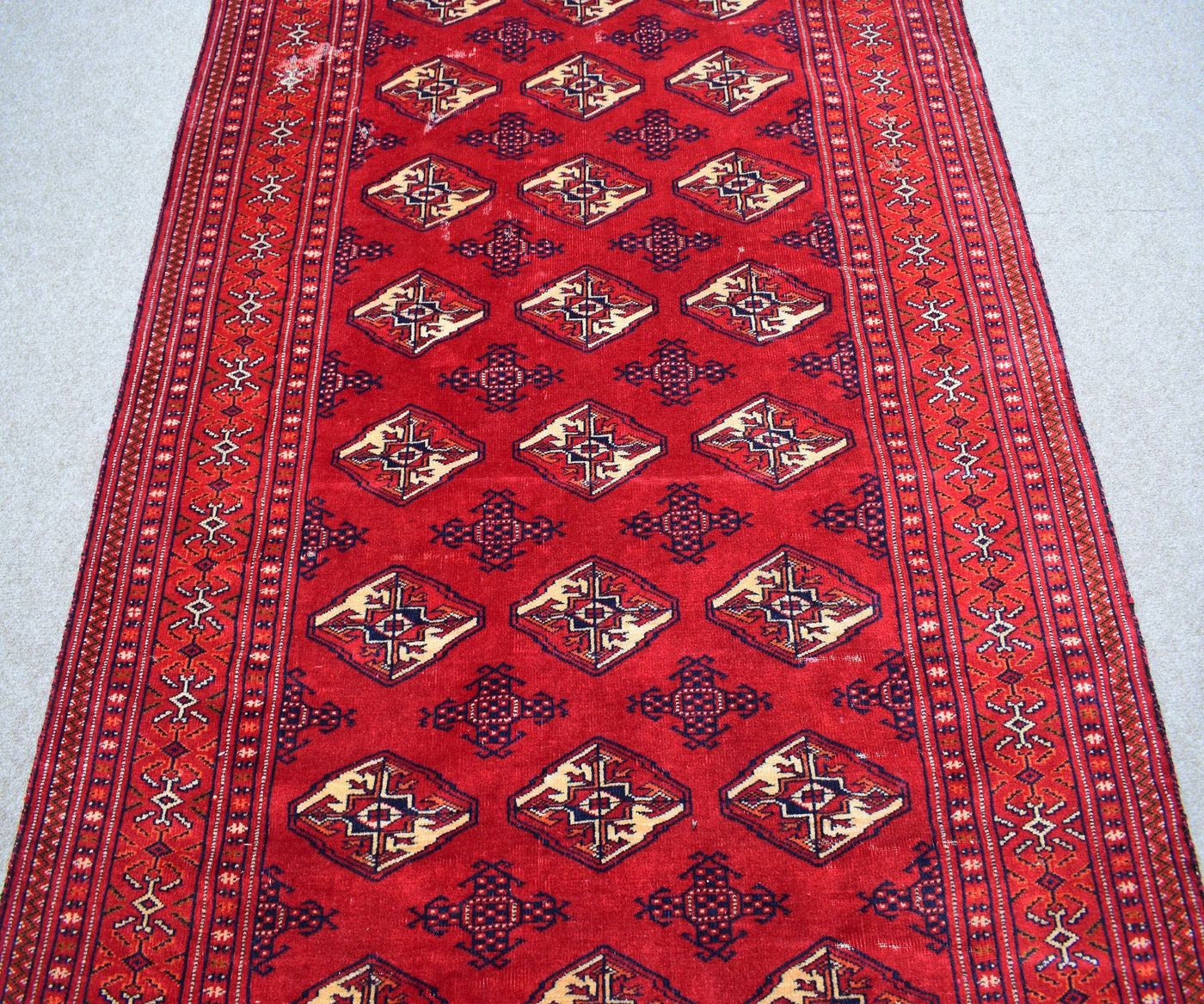 Vintage Shiraz Persian rug runner style layout with geometric tribal design and ivory accents