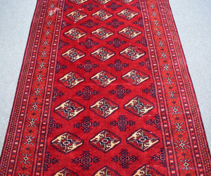 Vintage Shiraz Persian rug runner style layout with geometric tribal design and ivory accents