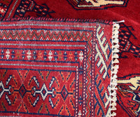 Backside of hand knotted vintage Persian Shiraz rug showing authentic flatwoven edge and traditional weaving structure