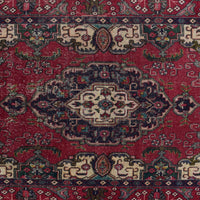 Detailed view of Shiraz rug midsection showing intricate geometric floral pattern on red field