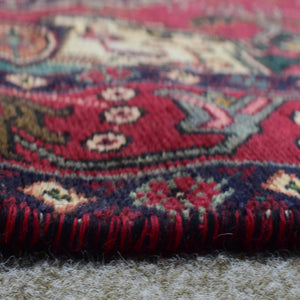 Low angle close-up of Shiraz rug pile showing thick wool texture and vibrant colors