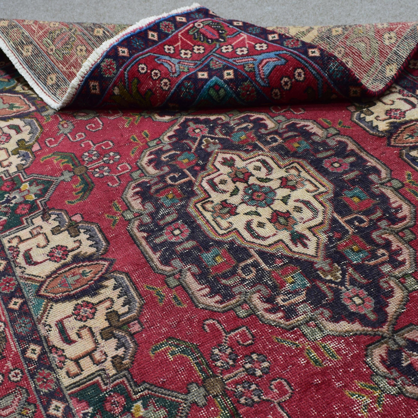 Close-up corner view of vintage Shiraz rug highlighting medallion edge and field motifs