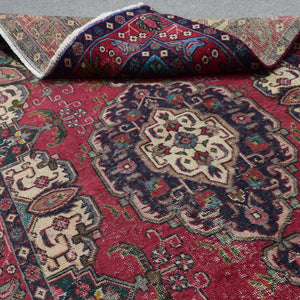 Close-up corner view of vintage Shiraz rug highlighting medallion edge and field motifs