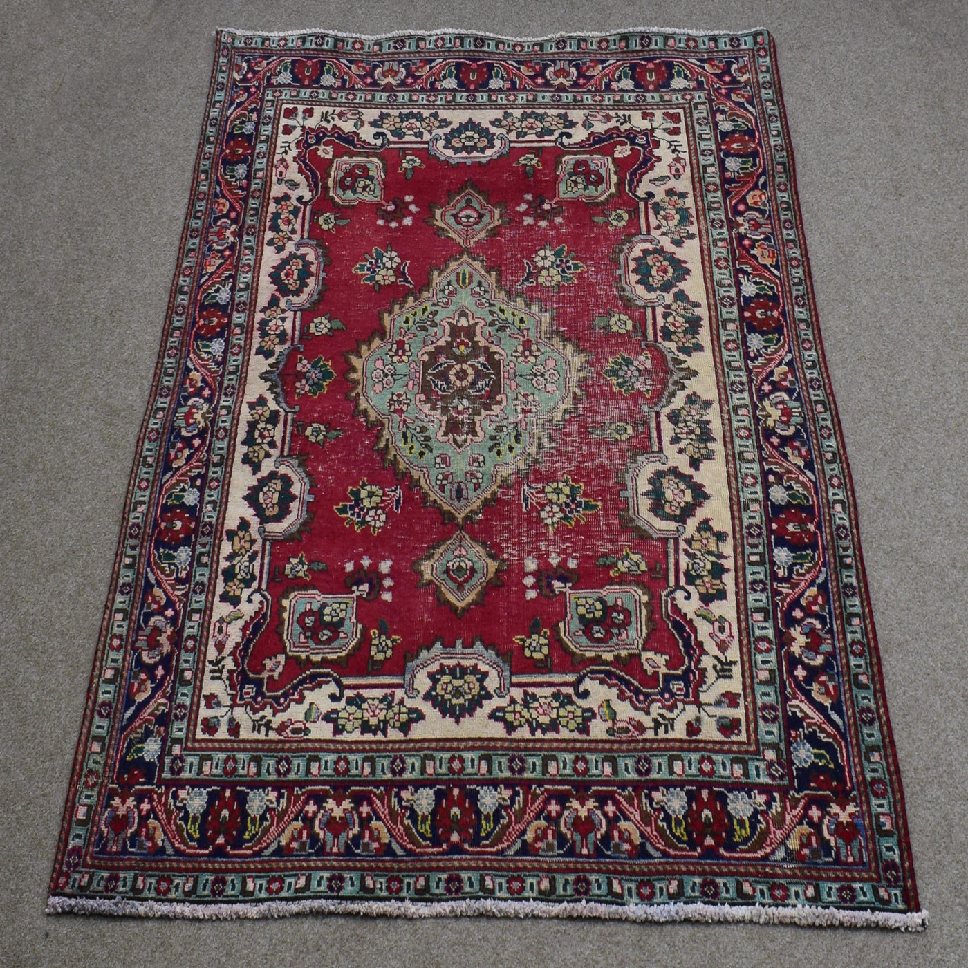 Full length view of Shiraz rug 137x198 cm showing ornate medallion and ivory floral borders