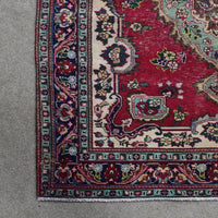 Border detail of Persian Shiraz rug featuring layered guard stripes and geometric floral designs