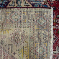 Backside of hand knotted Shiraz rug showing weave density and traditional wool foundation