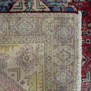Backside of hand knotted Shiraz rug showing weave density and traditional wool foundation
