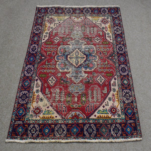 Full length view of Shiraz rug 127x175 cm showing central diamond medallion and ivory corner spandrels