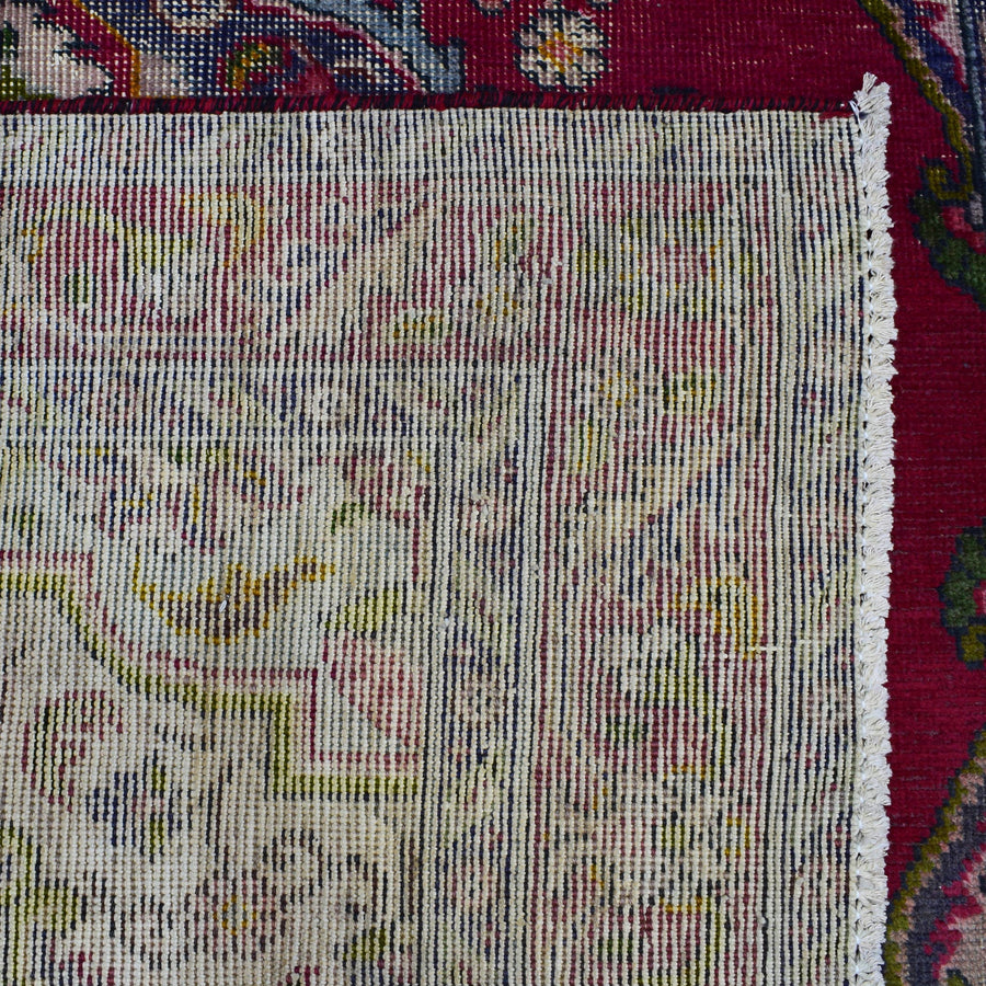 Backside of hand knotted Shiraz rug showing fine weave density and traditional wool foundation