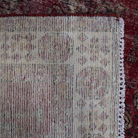 Backside of hand knotted Shiraz rug showing weave structure and traditional wool foundation