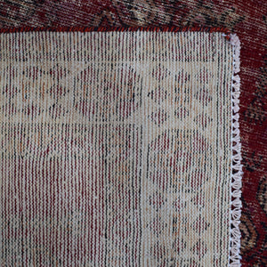 Backside of hand knotted Shiraz rug showing weave structure and traditional wool foundation